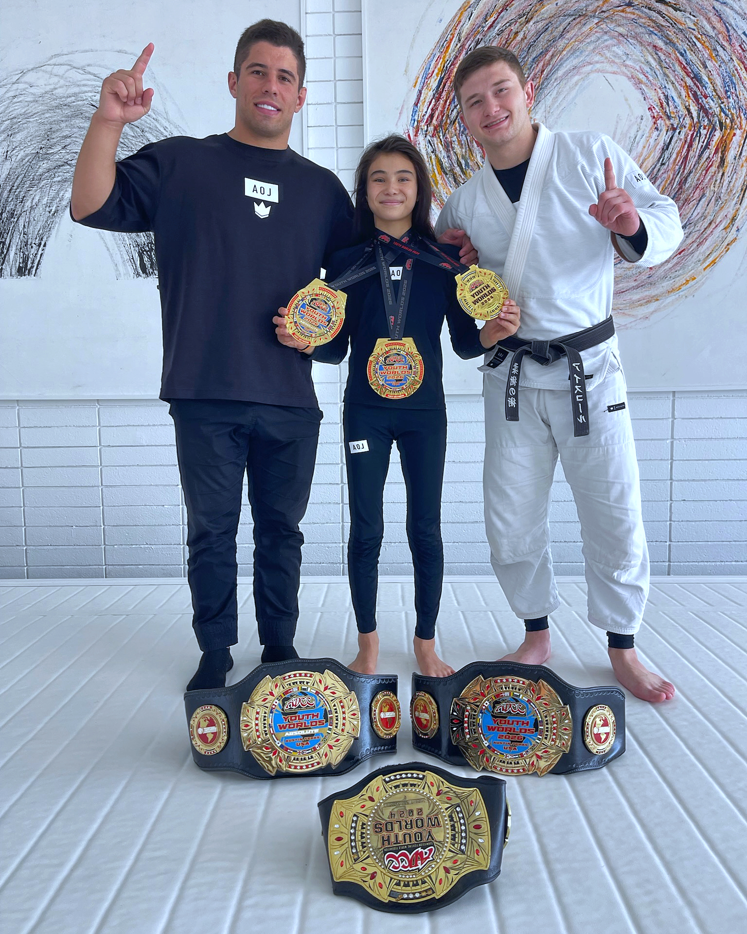 Bailey Heinsohn with her ADCC Youth World Championship medals and belts after becoming a 2× ADCC Youth World Champion in 2026.